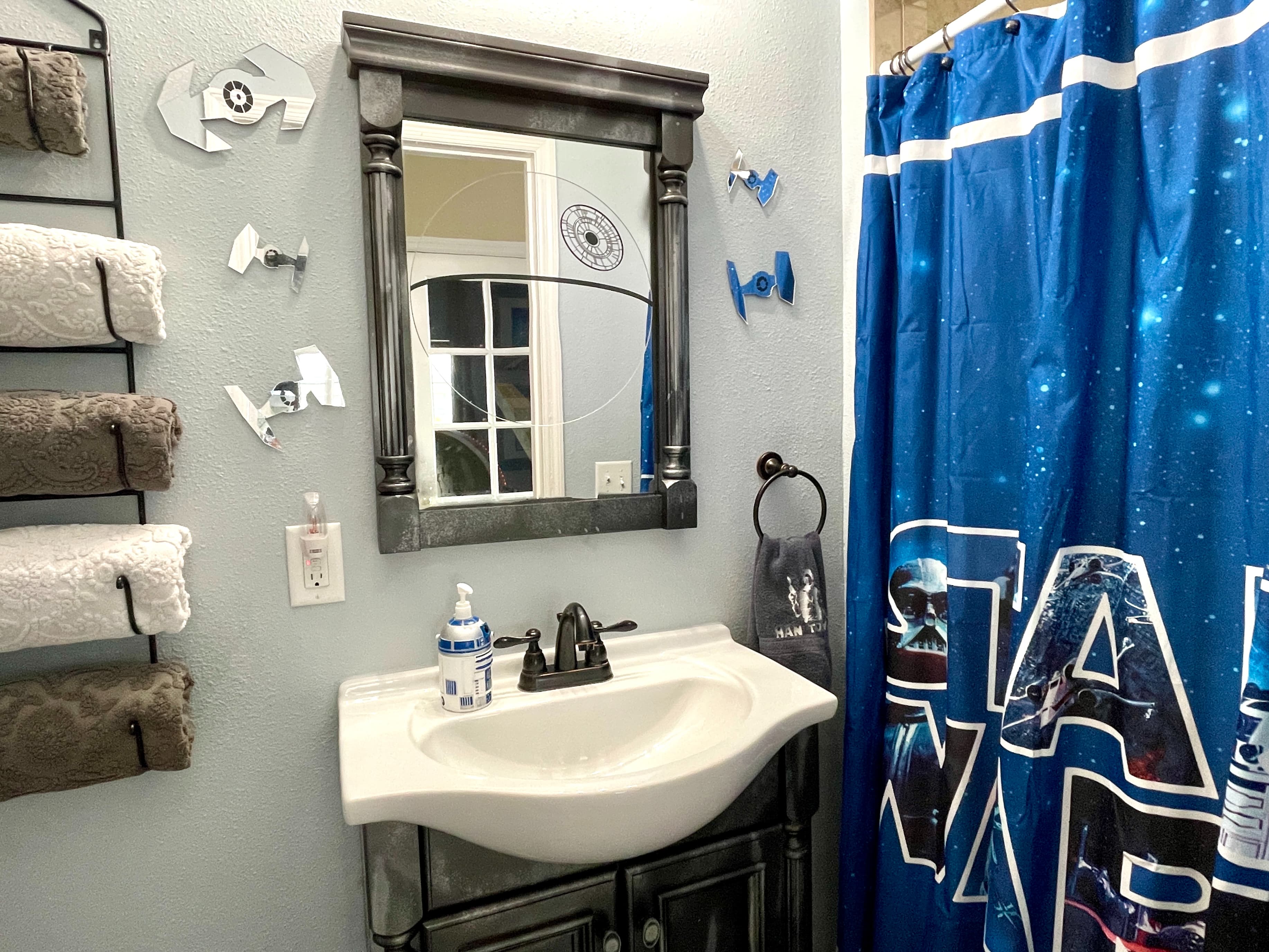Detached STAR WARS bathroom is just two steps into the hall from the STAR WARS and ENCANTO bedrooms.