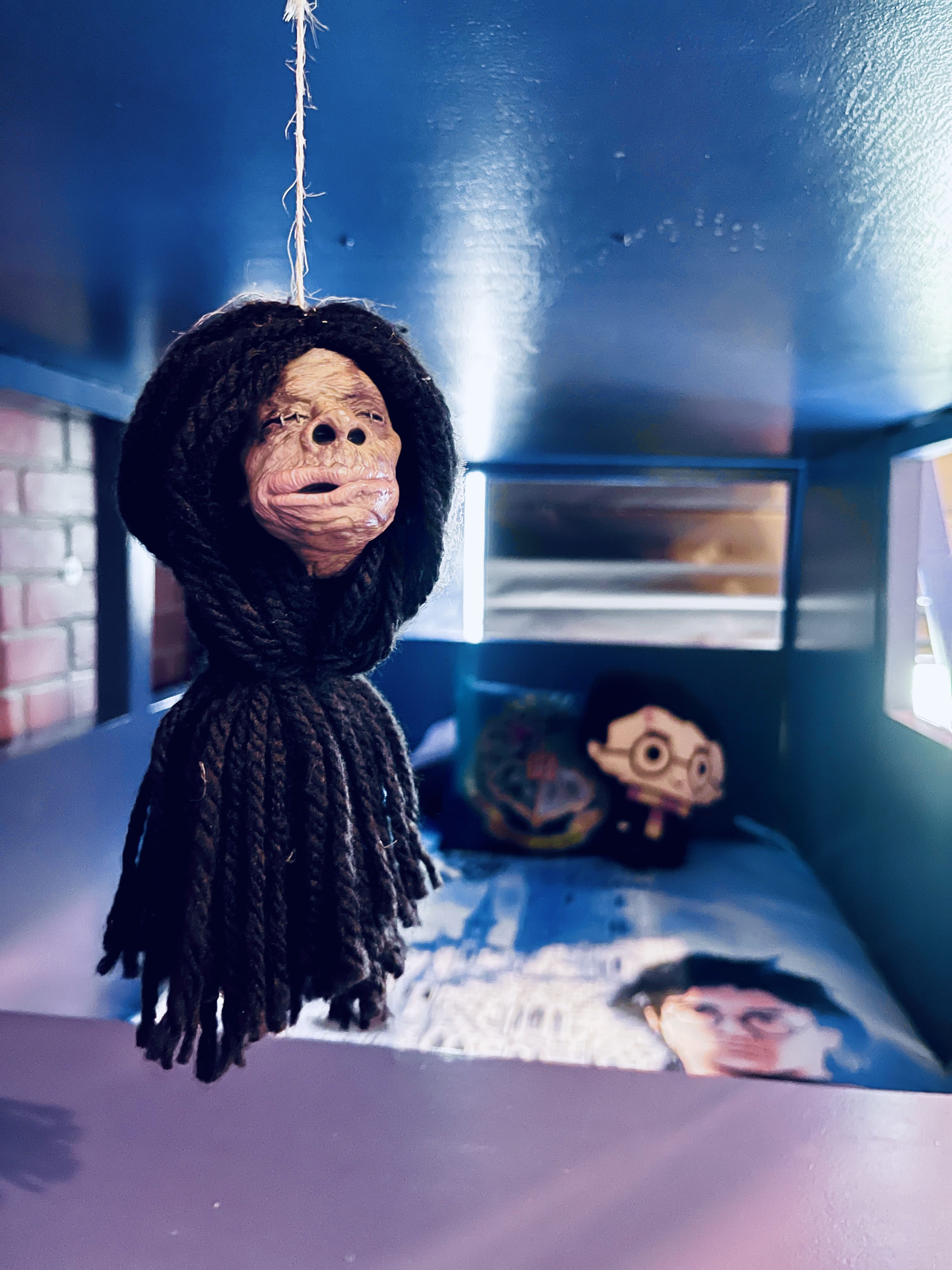 This cute shrunken head make fun commentary at the push of a button.