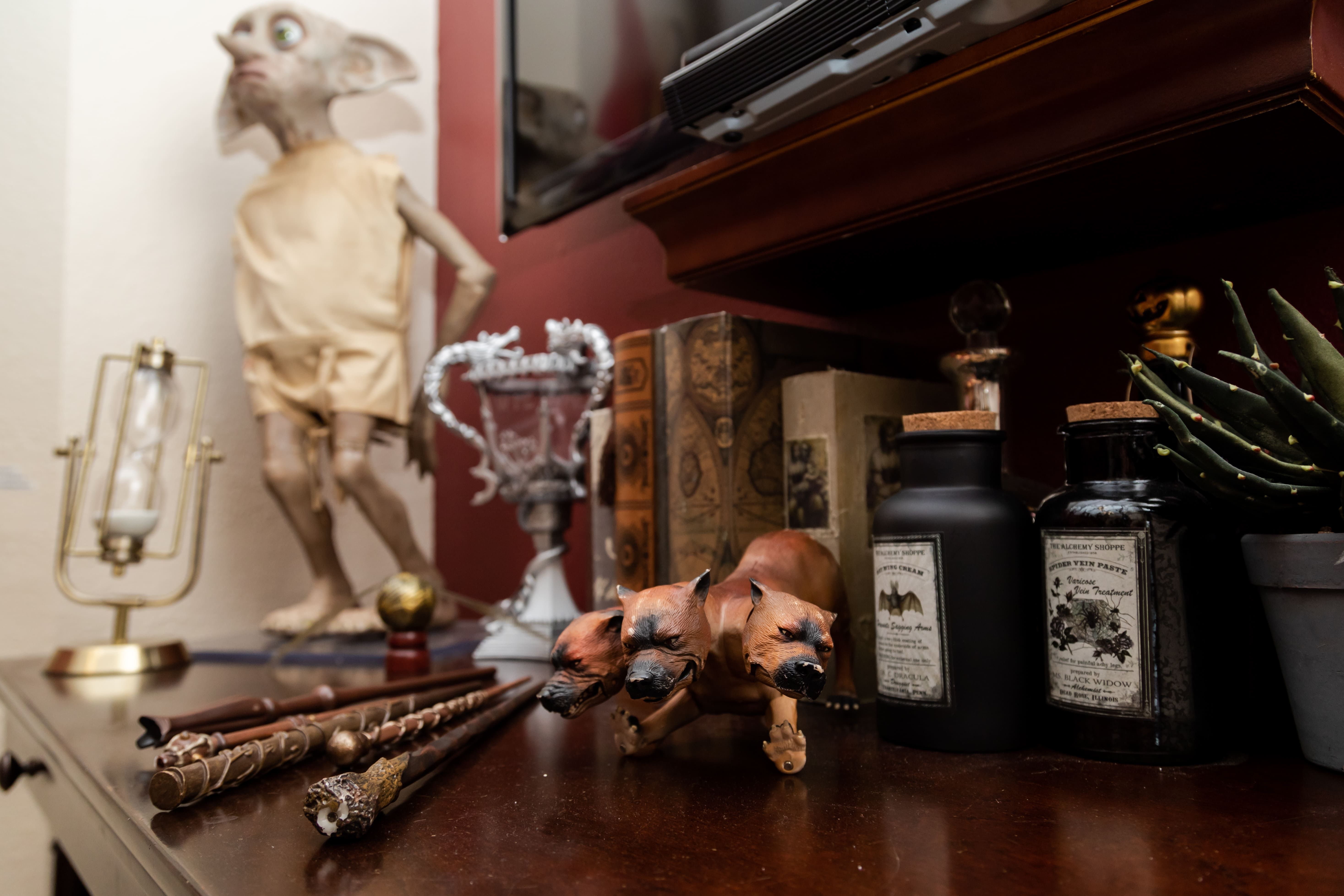 Life-sized Dobby keeps watch over Harry's potions and personal effects.