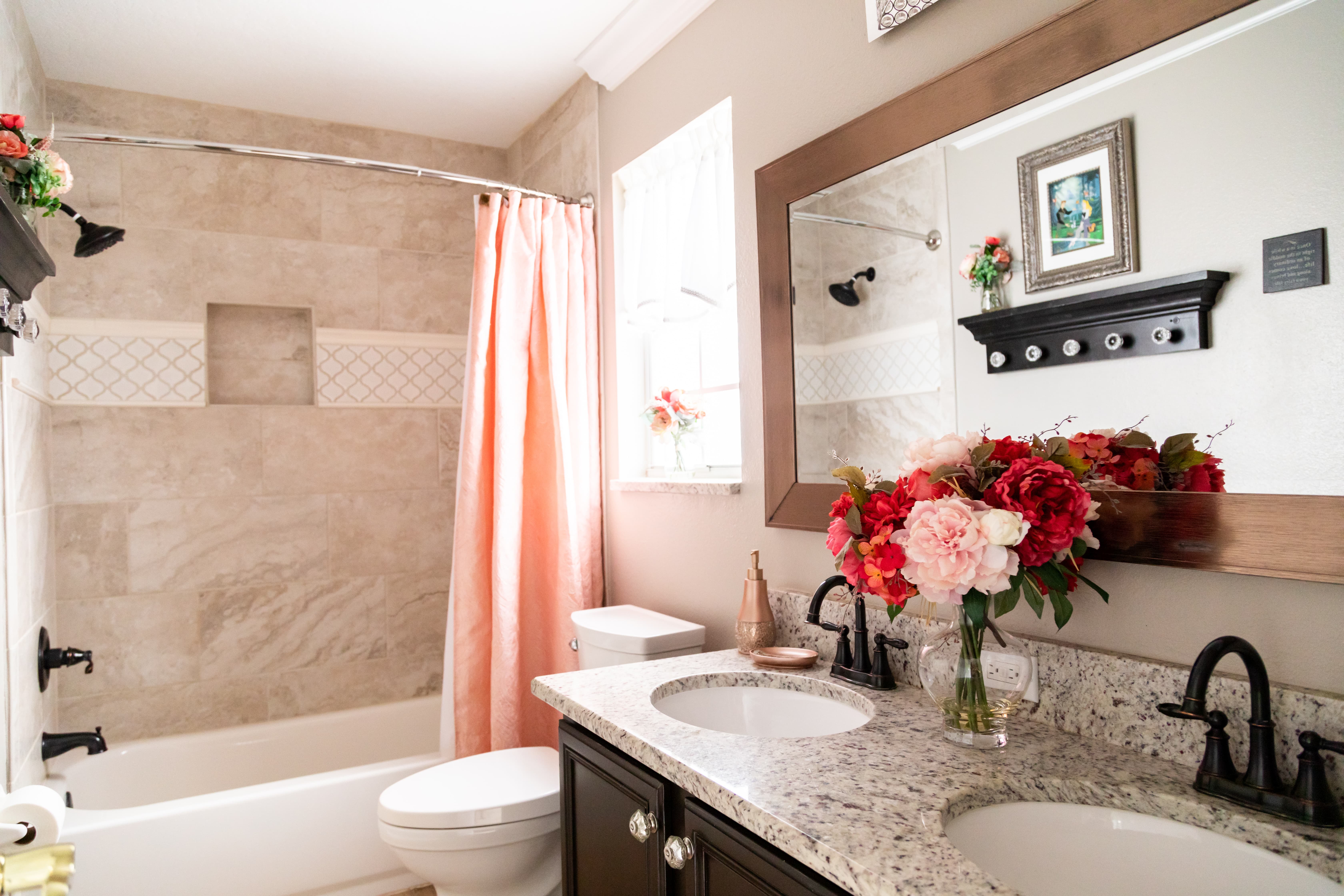 With a luxurious shower/bathtub combo and double sinks, this bathroom is perfect for families!
