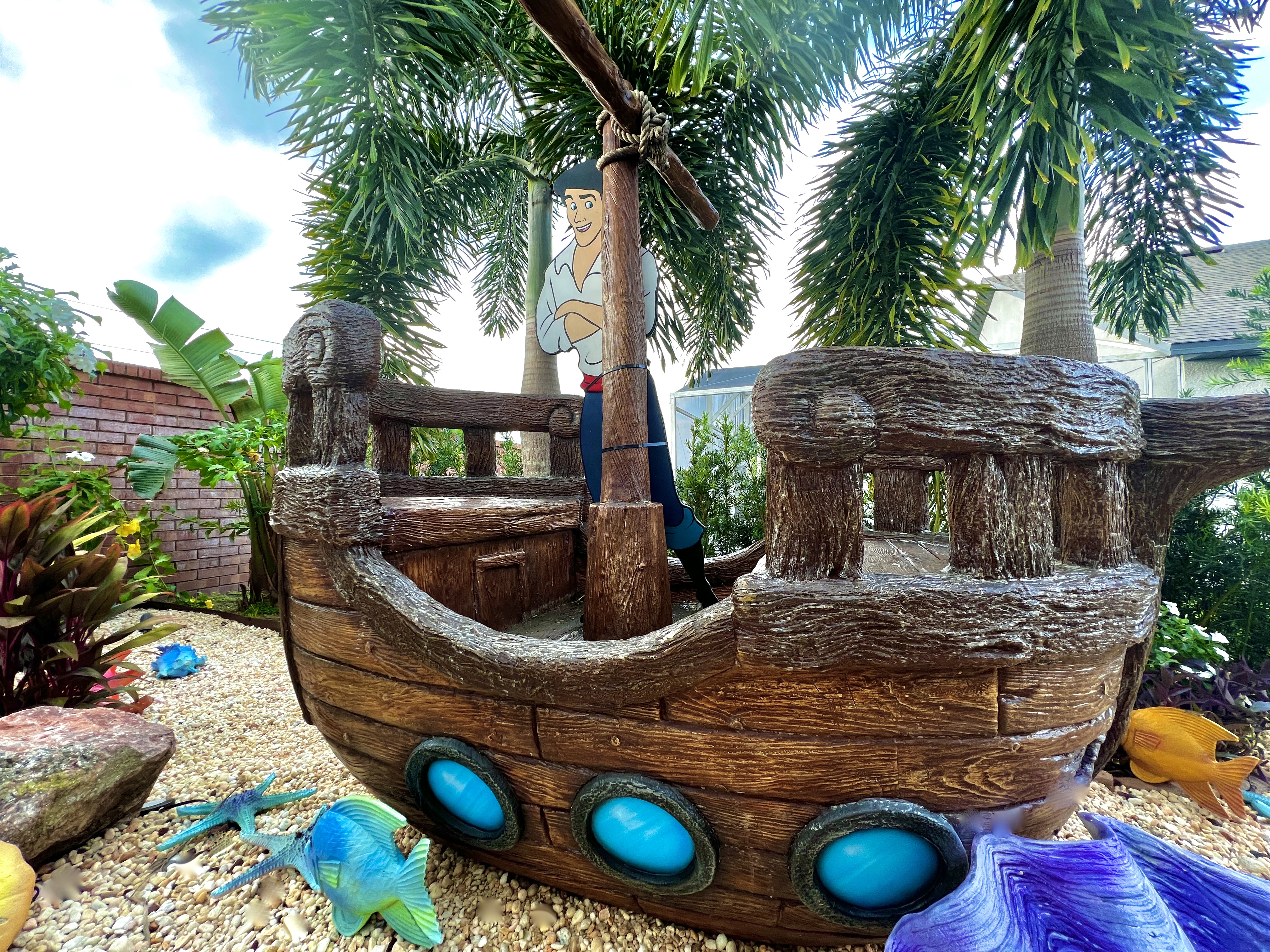 Send the kids outdoors for play adventures and pictures on Prince Eric's shipwrecked boat!