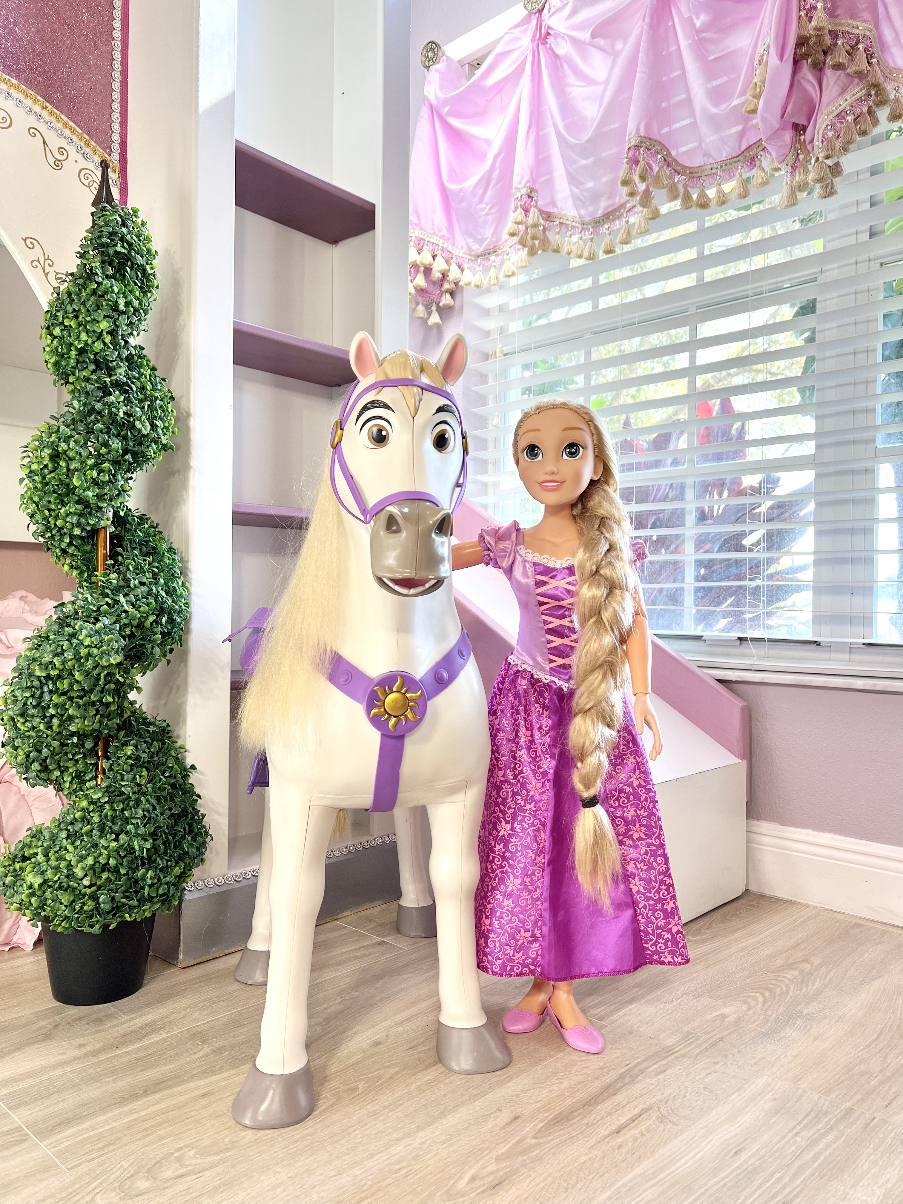 Rapunzel and Maximus are two of the many dozens of dolls in this Princess room, including Barbies and toddler dolls.