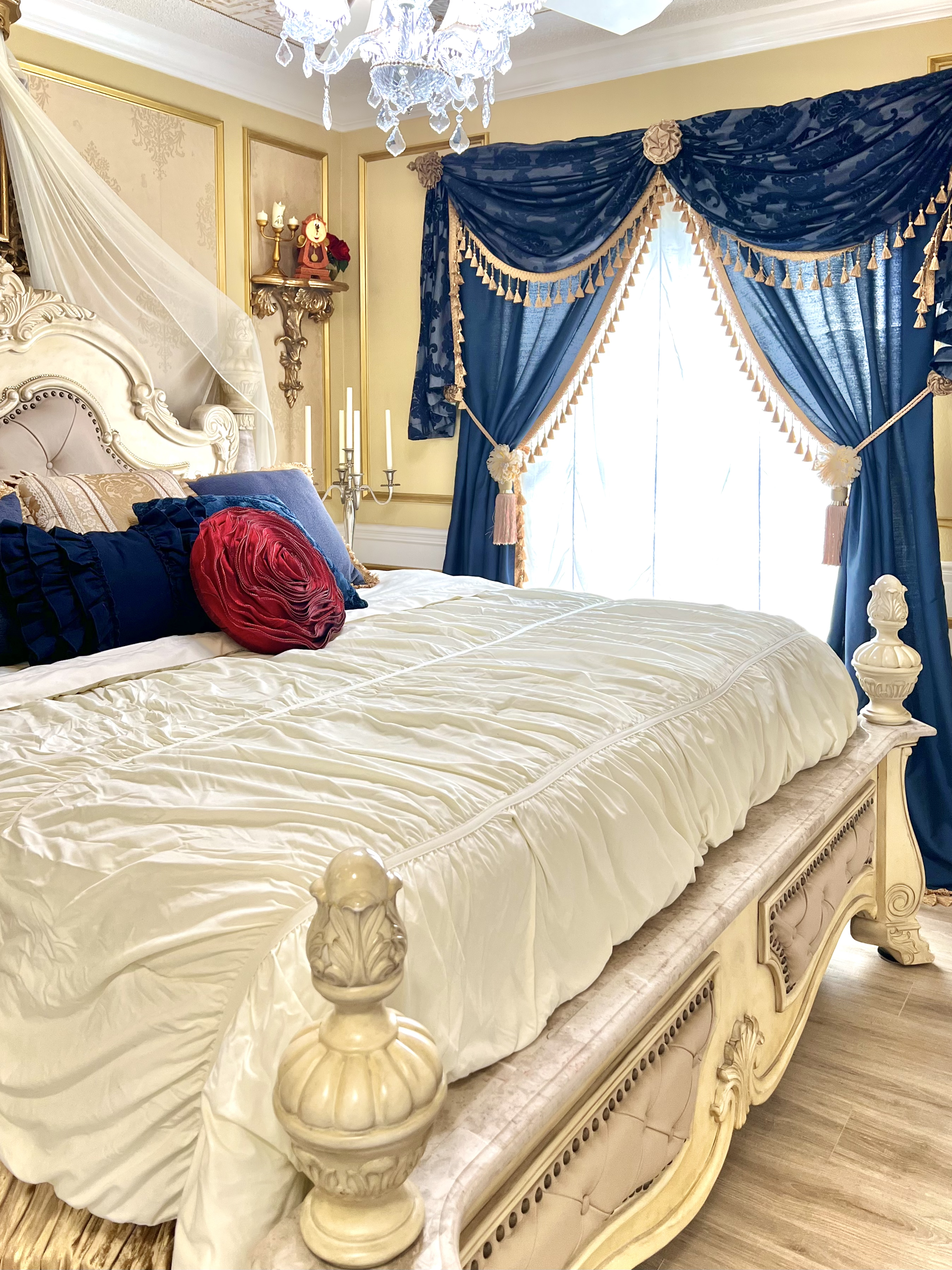 Belle's bedroom has claw feet, a crystal chandelier, damask drapes (and a modern TV with Roku and cable)!